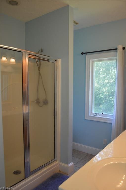 198 Savannah Ln, Mount Airy, NC 27030 - bathroom featuring a shower stall, tile patterned floors, baseboards, and vanity