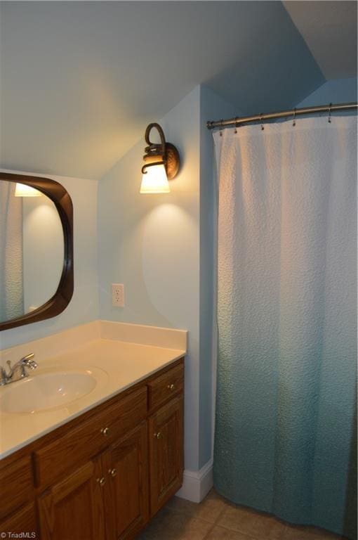 198 Savannah Ln, Mount Airy, NC 27030 - bathroom with lofted ceiling, vanity, tile patterned flooring, and a shower with curtain