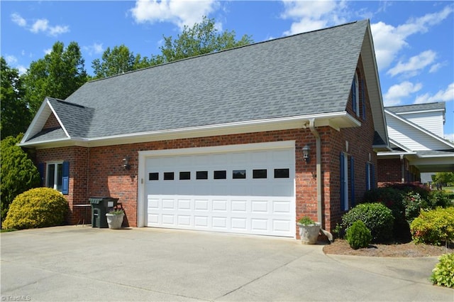 198 Savannah Ln, Mount Airy, NC 27030 - view of side of property with concrete driveway, brick siding, an attached garage, and roof with shingles
