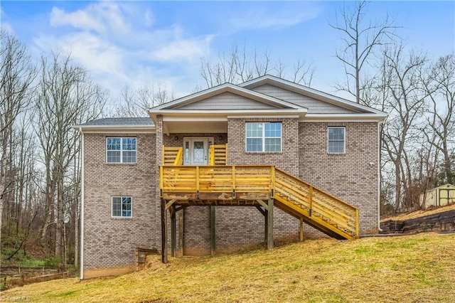 exterior space featuring a deck and a lawn