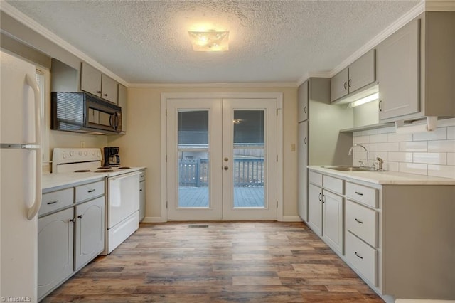 kitchen with french doors, sink, white appliances, gray cabinets, and ornamental molding