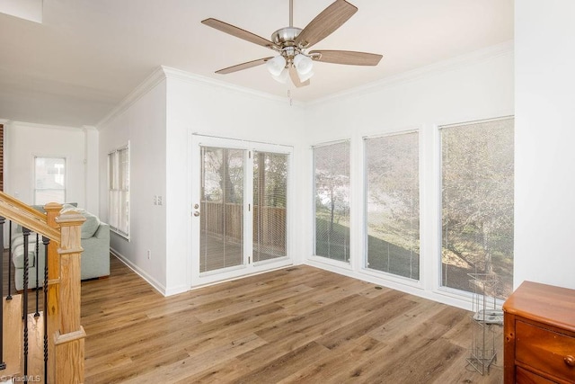 sunroom / solarium with ceiling fan and a wealth of natural light