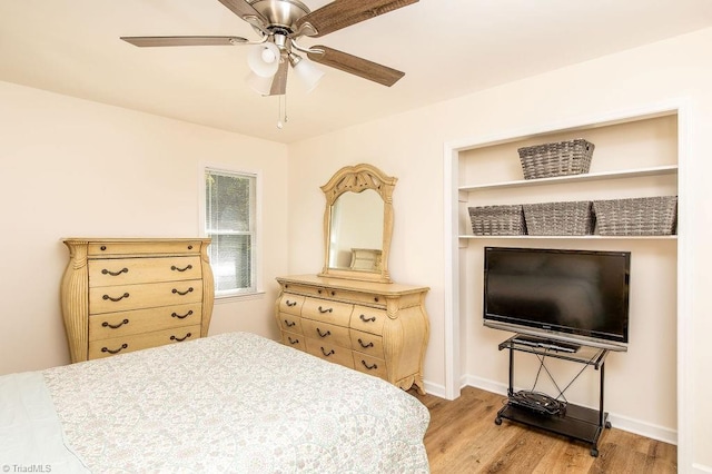 bedroom with light wood-type flooring and ceiling fan