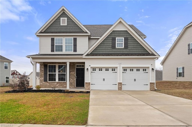 craftsman-style home with a porch, a garage, and a front yard