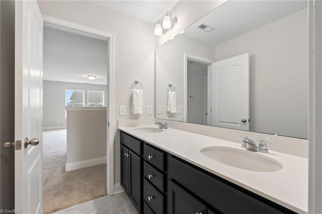 bathroom featuring tile patterned floors and vanity