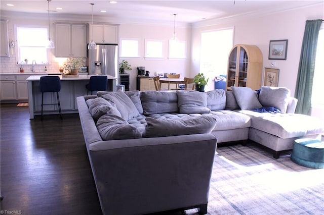 living room featuring recessed lighting, dark wood-style flooring, and crown molding