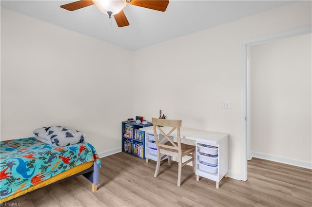 bedroom featuring light wood-type flooring, baseboards, and ceiling fan