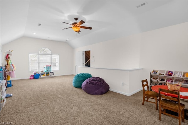 game room featuring visible vents, carpet flooring, ceiling fan, and vaulted ceiling