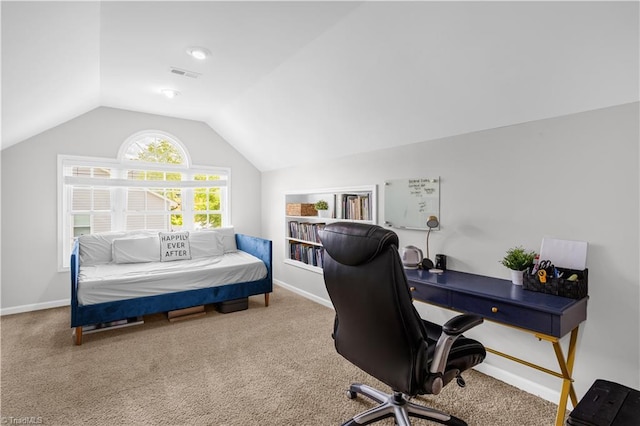 office area featuring carpet flooring, baseboards, and lofted ceiling