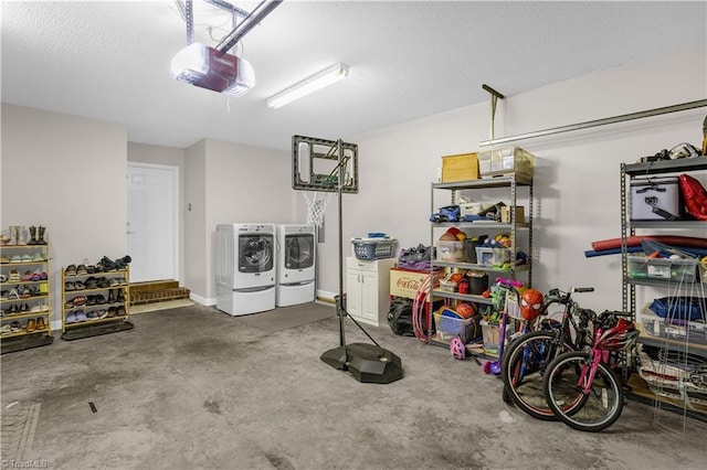 garage with a garage door opener and washing machine and clothes dryer
