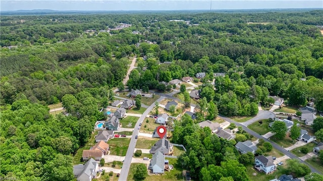 bird's eye view featuring a view of trees