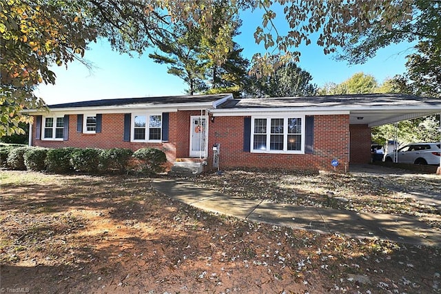 ranch-style home with a carport