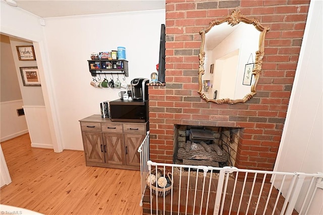 interior space featuring a fireplace and light wood-type flooring