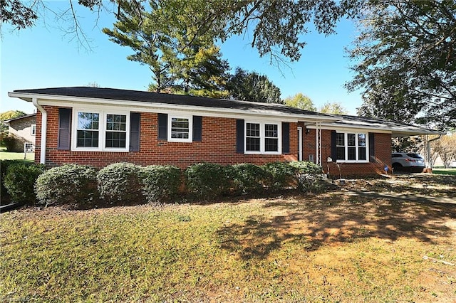 ranch-style home with a front lawn