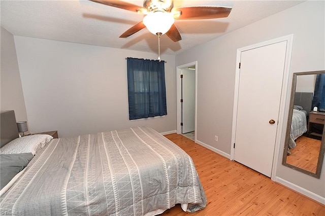 bedroom featuring light hardwood / wood-style flooring and ceiling fan