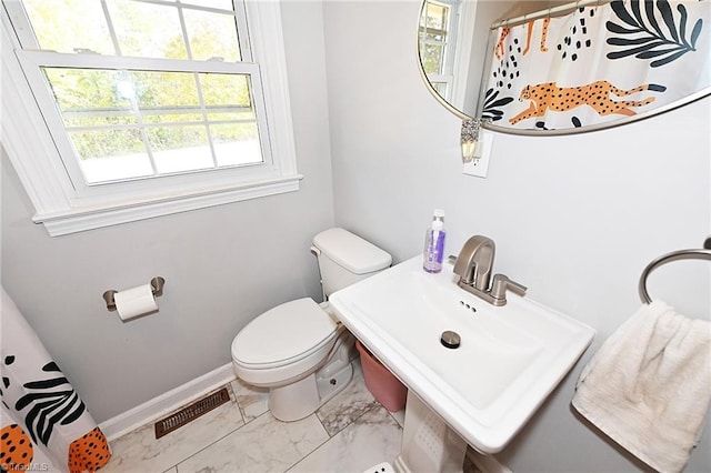 bathroom with toilet and sink