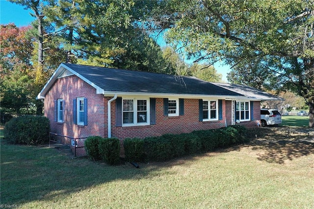 view of side of home featuring a yard