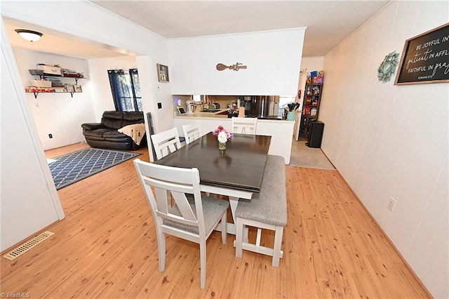 dining space featuring light hardwood / wood-style flooring