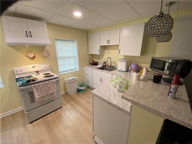 301 Jeanette Ave, High Point, NC 27265 - kitchen featuring white electric range, a sink, white cabinetry, and light wood-type flooring