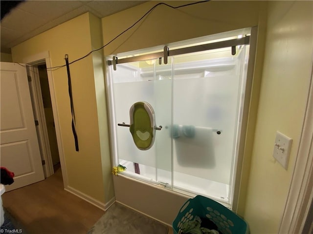 301 Jeanette Ave, High Point, NC 27265 - bathroom with baseboards, enclosed tub / shower combo, and wood finished floors