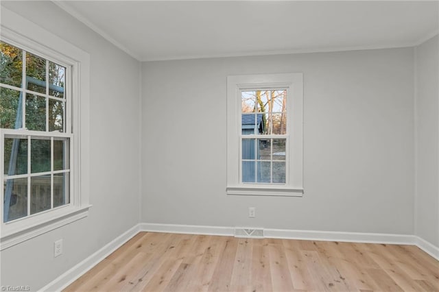 spare room featuring light hardwood / wood-style flooring