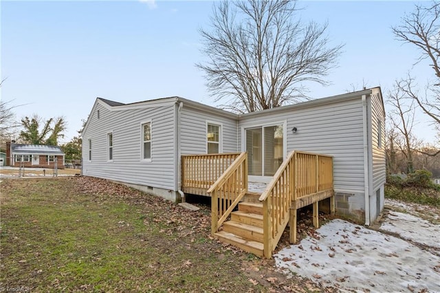 rear view of house featuring a deck