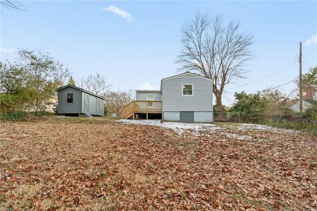 rear view of property featuring a deck