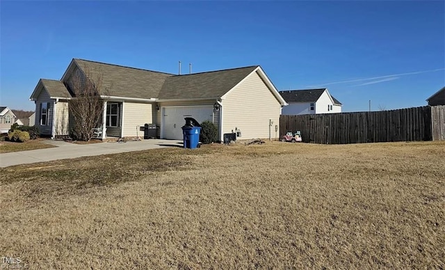 view of home's exterior featuring a garage and a yard