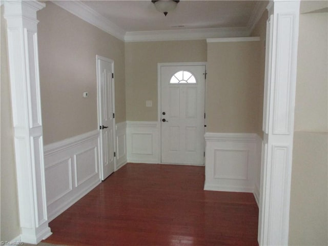 917 Avalon Acres Ct, High Point, NC 27265 - entryway with ornate columns, a wainscoted wall, a decorative wall, dark wood-style floors, and ornamental molding