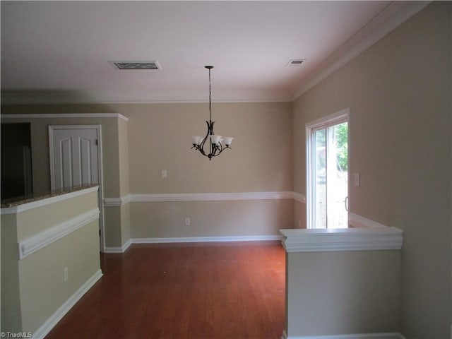 917 Avalon Acres Ct, High Point, NC 27265 - unfurnished dining area featuring wood finished floors, a chandelier, crown molding, and baseboards
