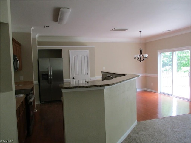 917 Avalon Acres Ct, High Point, NC 27265 - kitchen featuring stainless steel fridge with ice dispenser, black range with electric stovetop, a chandelier, pendant lighting, and crown molding