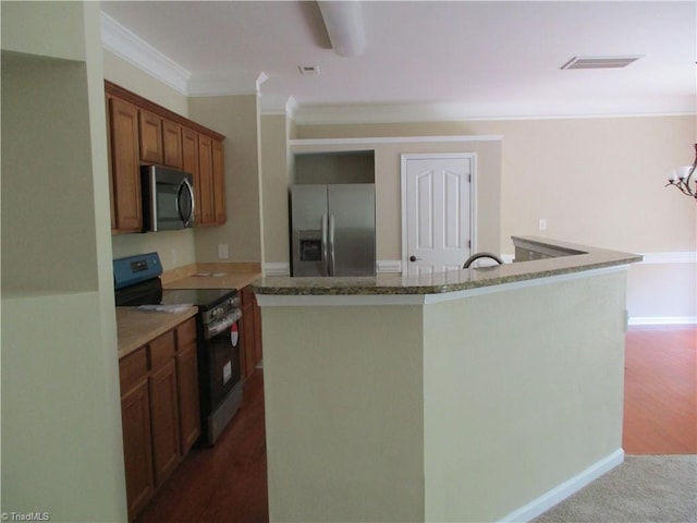 917 Avalon Acres Ct, High Point, NC 27265 - kitchen featuring stainless steel appliances, ornamental molding, brown cabinetry, a kitchen island, and stone countertops
