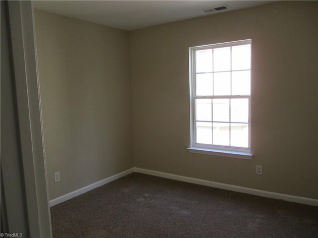 917 Avalon Acres Ct, High Point, NC 27265 - spare room featuring dark colored carpet and baseboards