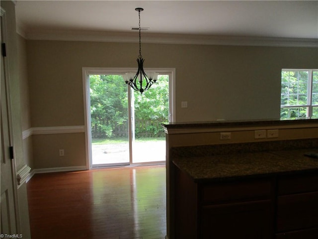917 Avalon Acres Ct, High Point, NC 27265 - kitchen with wood finished floors, ornamental molding, a chandelier, baseboards, and pendant lighting