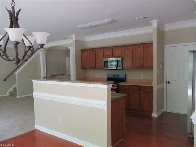 917 Avalon Acres Ct, High Point, NC 27265 - kitchen with stainless steel appliances, brown cabinetry, ornate columns, ornamental molding, and arched walkways