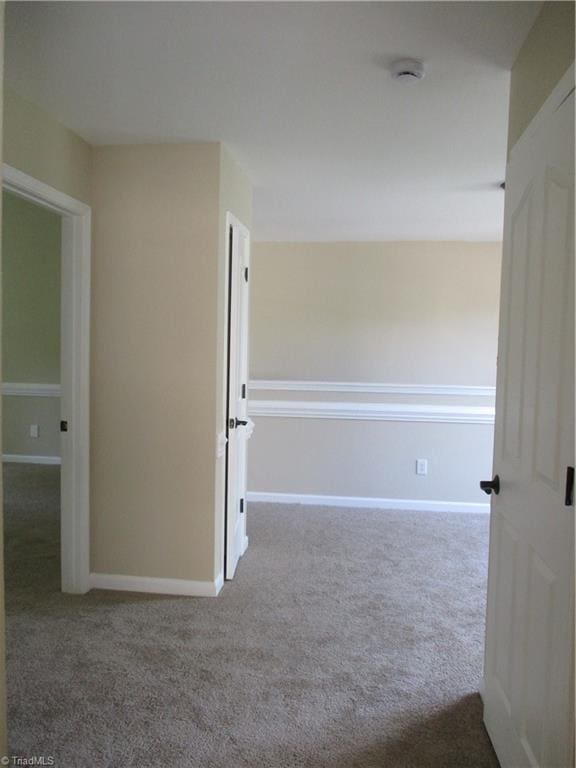 917 Avalon Acres Ct, High Point, NC 27265 - carpeted empty room with a smoke detector and baseboards