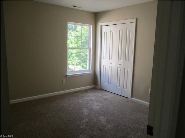 917 Avalon Acres Ct, High Point, NC 27265 - unfurnished bedroom featuring carpet, baseboards, and a closet