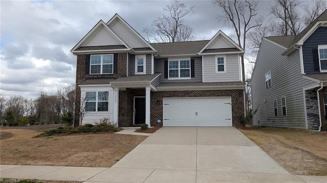 view of front facade with concrete driveway, brick siding, board and batten siding, and an attached garage