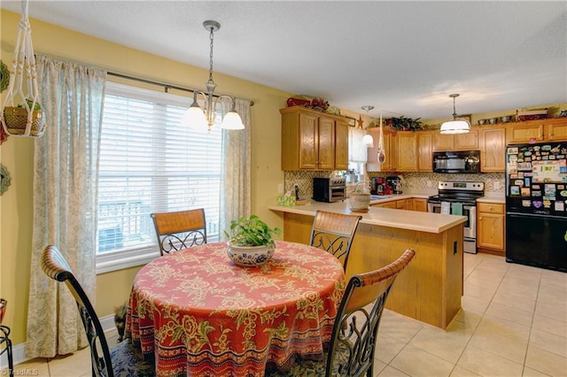 dining room with light tile patterned floors, sink, a wealth of natural light, and a chandelier