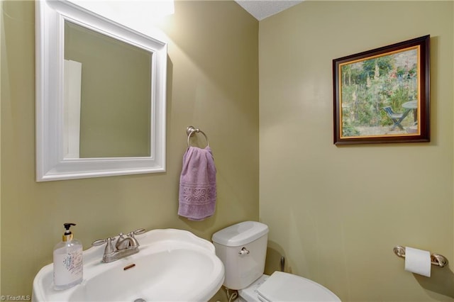 bathroom with toilet and sink