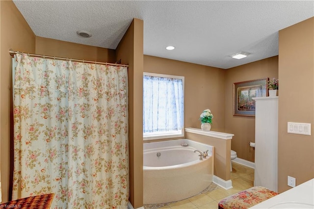 full bathroom featuring tile patterned floors, a textured ceiling, and toilet