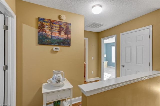 interior space featuring a textured ceiling