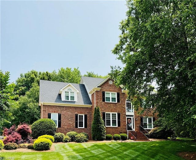 4712 Weston Pl, Jamestown, NC 27282 - view of front of home featuring a front lawn and brick siding