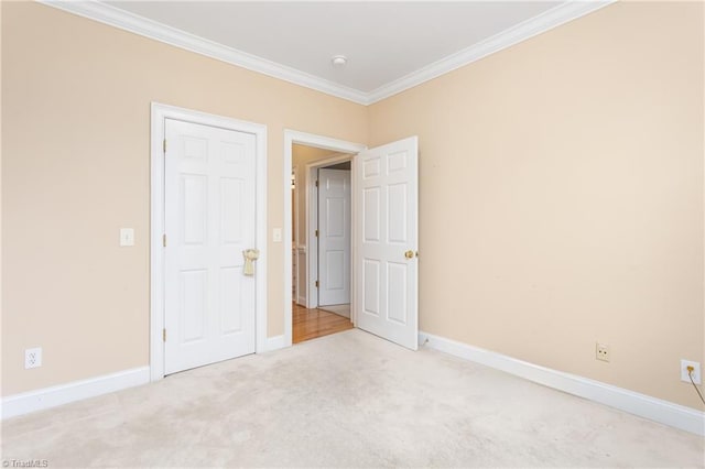 2012 Muirfield Ct, Elon, NC 27244 - unfurnished bedroom with crown molding, light carpet, and baseboards