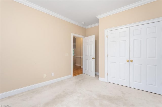 2012 Muirfield Ct, Elon, NC 27244 - unfurnished bedroom with carpet floors, ornamental molding, baseboards, and a closet
