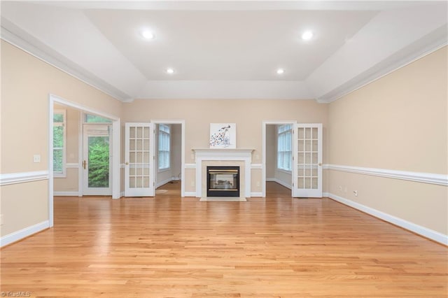 2012 Muirfield Ct, Elon, NC 27244 - unfurnished living room featuring light wood-style flooring, a raised ceiling, baseboards, a high end fireplace, and recessed lighting