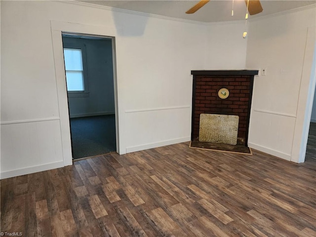 unfurnished living room featuring crown molding, dark hardwood / wood-style floors, and ceiling fan