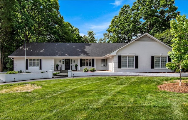 ranch-style house featuring a front yard and a porch