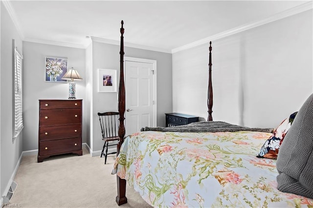 carpeted bedroom featuring crown molding and baseboards