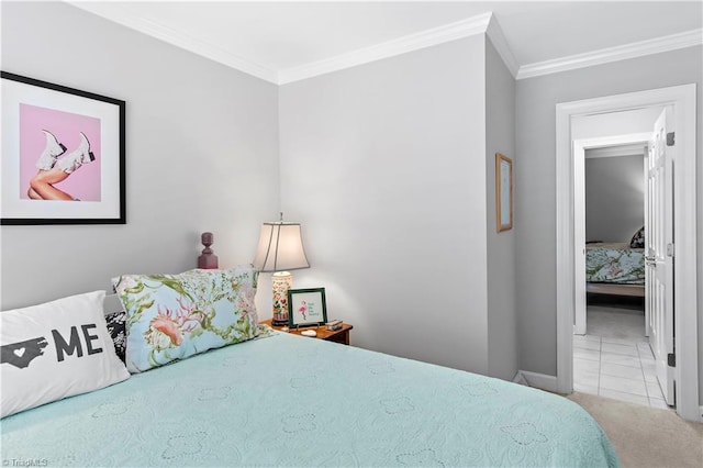 carpeted bedroom with crown molding and baseboards